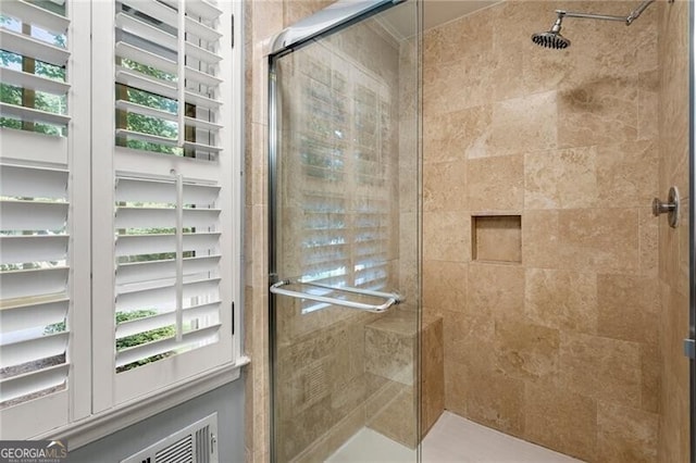 full bathroom featuring a shower stall