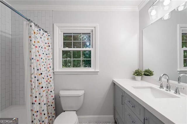 full bath with ornamental molding, toilet, vanity, baseboards, and shower / tub combo