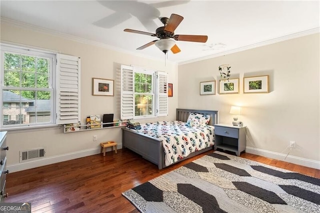 bedroom with ornamental molding, wood finished floors, baseboards, and ceiling fan