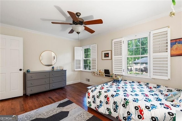 bedroom featuring wood finished floors, ornamental molding, baseboards, and ceiling fan
