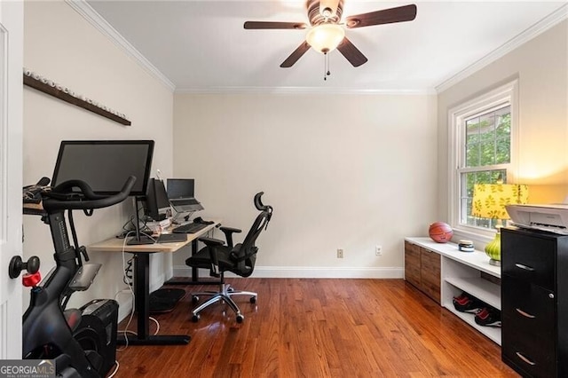 office area with wood finished floors, a ceiling fan, baseboards, and crown molding