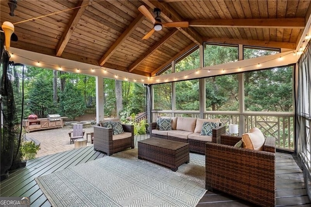 sunroom / solarium with an outdoor living space and a ceiling fan