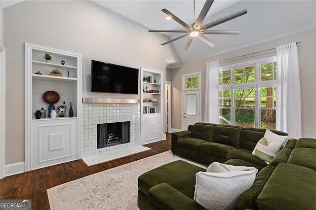 580 Cliftwood Ct, Sandy Springs, GA 30328 - living room with a ceiling fan, a tiled fireplace, vaulted ceiling, and wood finished floors