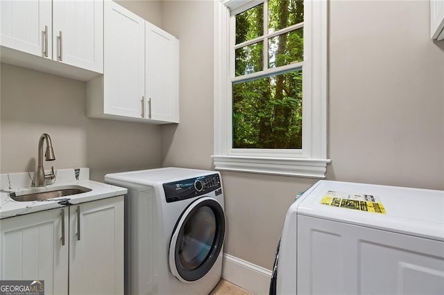580 Cliftwood Ct, Sandy Springs, GA 30328 - laundry area with cabinet space and separate washer and dryer