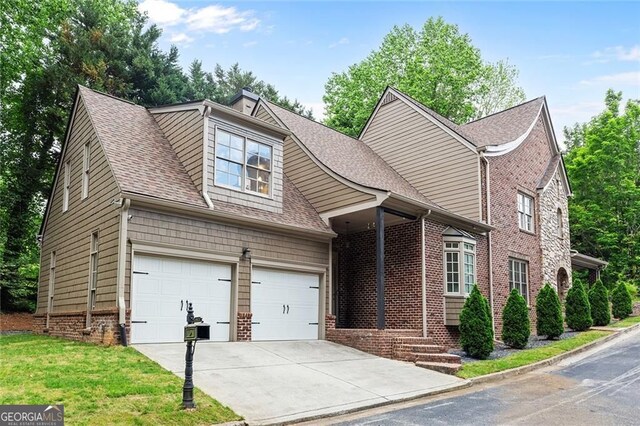 580 Cliftwood Ct, Sandy Springs, GA 30328 - view of front facade featuring concrete driveway, a shingled roof, brick siding, and a front lawn