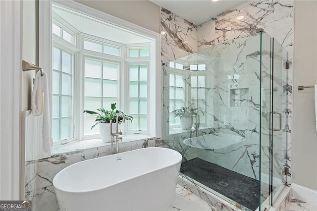 580 Cliftwood Ct, Sandy Springs, GA 30328 - bathroom with marble tiled floors, a freestanding bath, a marble finish shower, and tile walls