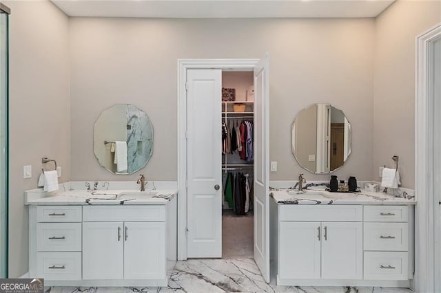 580 Cliftwood Ct, Sandy Springs, GA 30328 - full bath with marble look tile flooring, two vanities, and a spacious closet