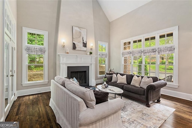 580 Cliftwood Ct, Sandy Springs, GA 30328 - living room with high vaulted ceiling, healthy amount of natural light, a fireplace, and dark wood-style flooring