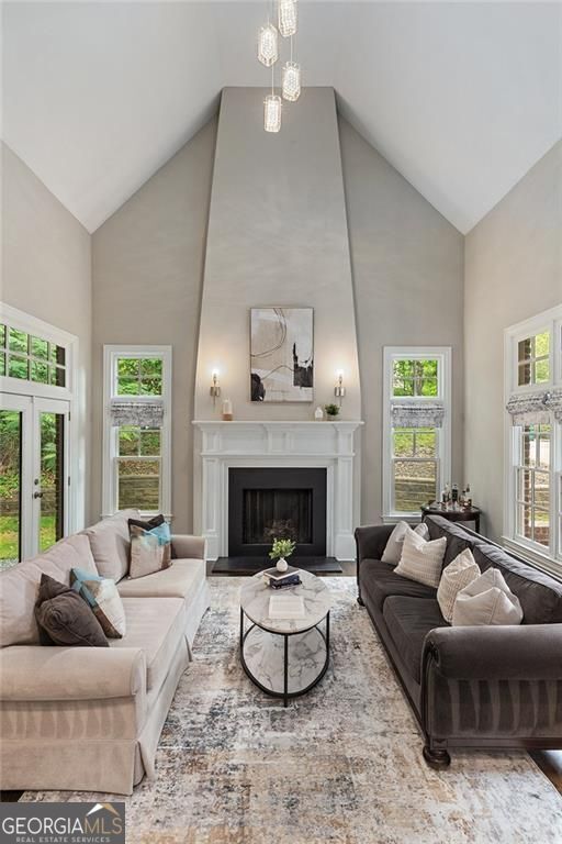 580 Cliftwood Ct, Sandy Springs, GA 30328 - living area featuring high vaulted ceiling, a fireplace, and french doors