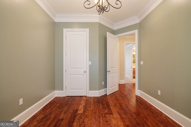 4345 Spring Branch Cir, Valdosta, GA 31601 - unfurnished bedroom with ornamental molding, a chandelier, dark wood-type flooring, and baseboards