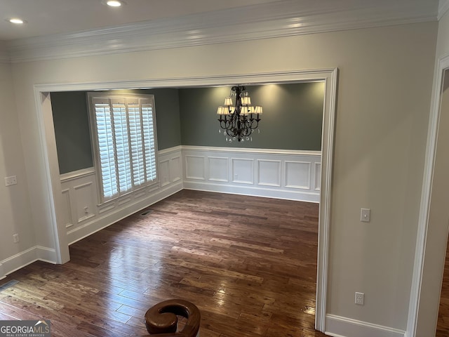 4345 Spring Branch Cir, Valdosta, GA 31601 - unfurnished dining area with crown molding, dark wood-style flooring, a chandelier, wainscoting, and recessed lighting