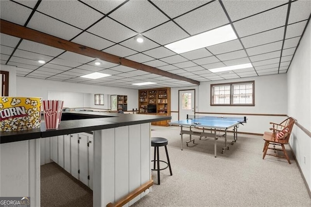 recreation room with light carpet