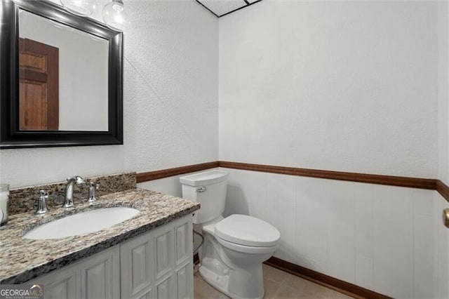 bathroom featuring toilet and vanity