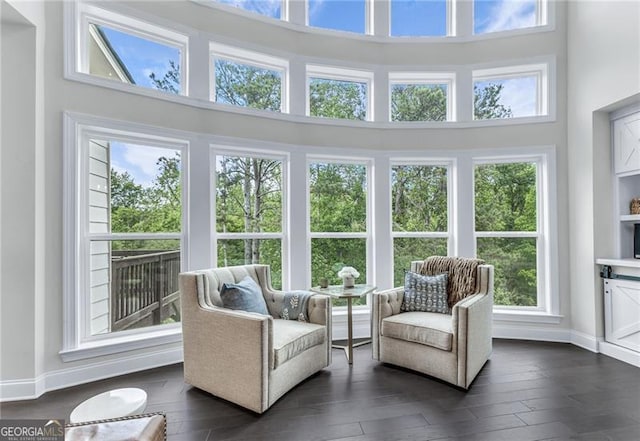 6150 Bridge Fair Rd, Cumming, GA 30028 - sunroom / solarium featuring a high ceiling, baseboards, and wood finished floors