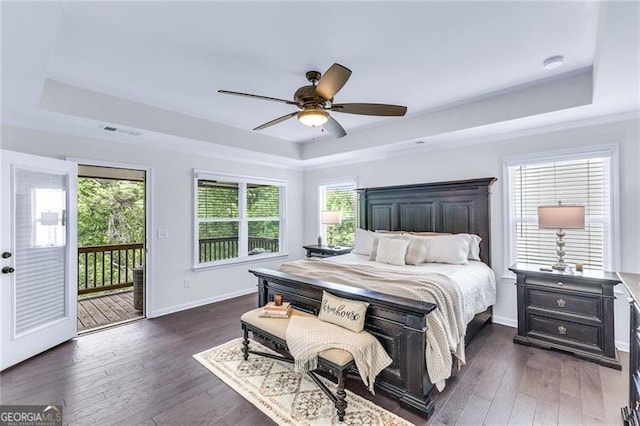 6150 Bridge Fair Rd, Cumming, GA 30028 - bedroom featuring a raised ceiling, access to exterior, dark wood-style floors, and baseboards