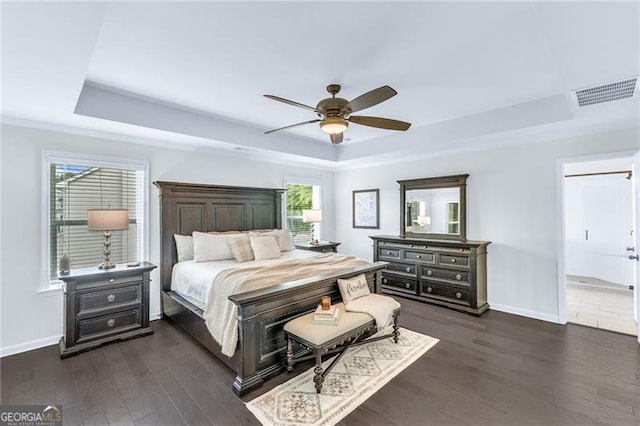 6150 Bridge Fair Rd, Cumming, GA 30028 - bedroom featuring a raised ceiling, baseboards, dark wood-style flooring, and a ceiling fan