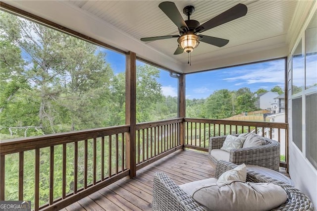 6150 Bridge Fair Rd, Cumming, GA 30028 - deck featuring ceiling fan and view of scattered trees