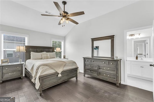 6150 Bridge Fair Rd, Cumming, GA 30028 - bedroom featuring vaulted ceiling, dark wood-type flooring, connected bathroom, baseboards, and ceiling fan