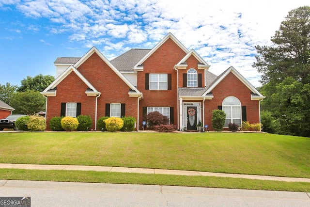 208 Summer Chase, Carrollton, GA 30116 - traditional-style house with brick siding and a front yard