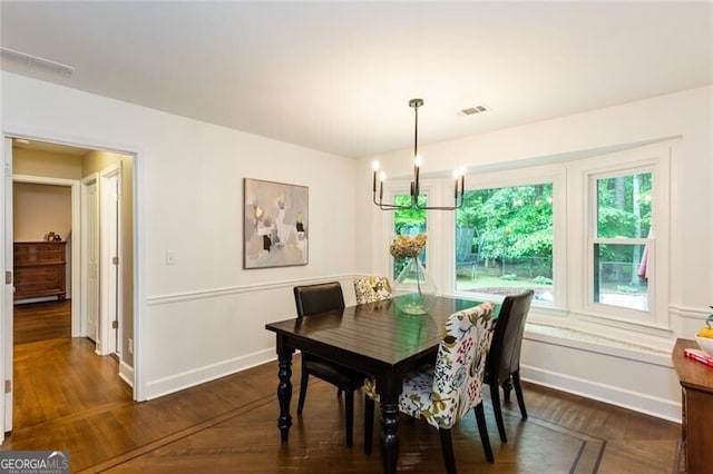 dining room with dark wood-style floors and baseboards