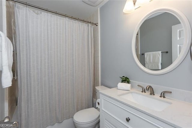 bathroom with toilet, vanity, and shower / tub combo with curtain