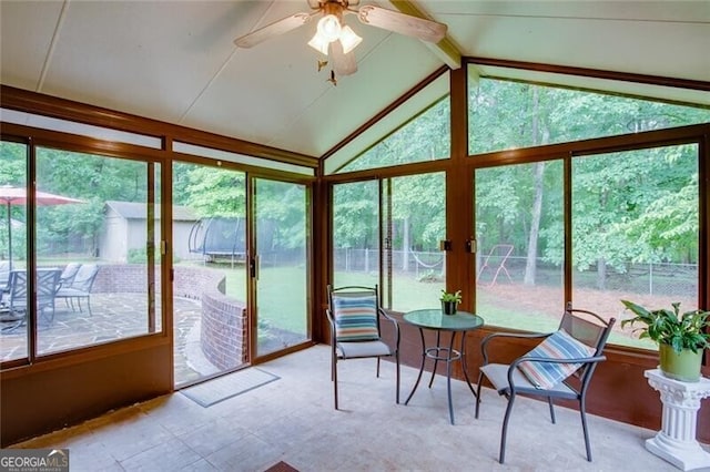 sunroom with plenty of natural light and a ceiling fan