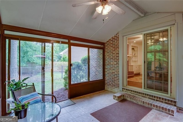 sunroom / solarium with ceiling fan and outdoor dining area