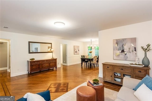 living room with wood finished floors and baseboards