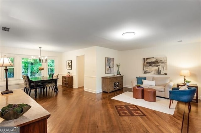 living room with wood finished floors and baseboards