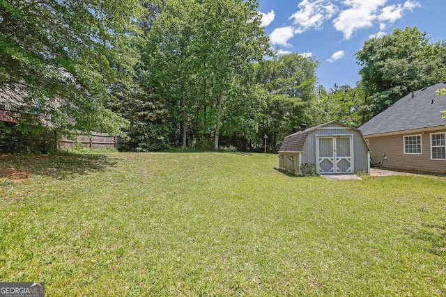 view of yard with a storage unit and an outdoor structure