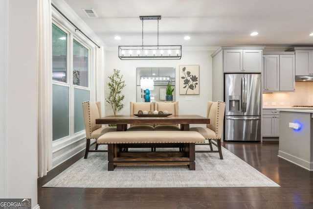 dining area featuring dark wood-style flooring and recessed lighting