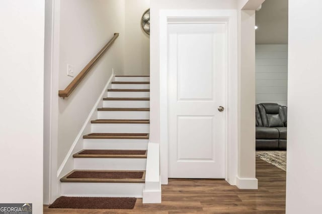 stairway with wood finished floors