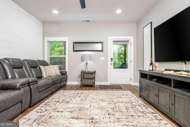living room featuring plenty of natural light, wood finished floors, recessed lighting, and a ceiling fan