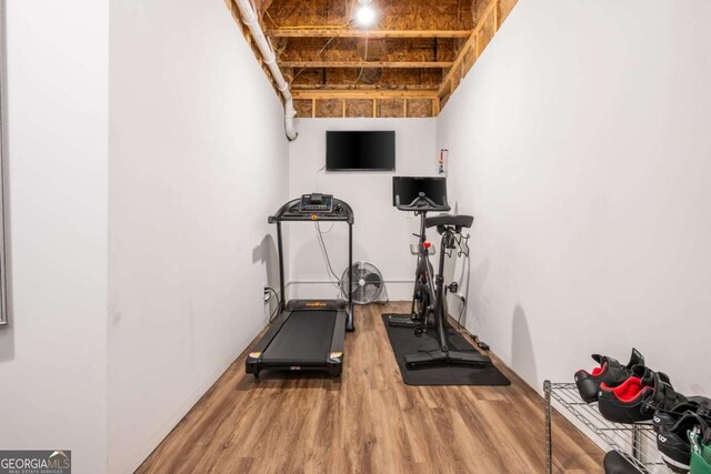 exercise room with wood finished floors