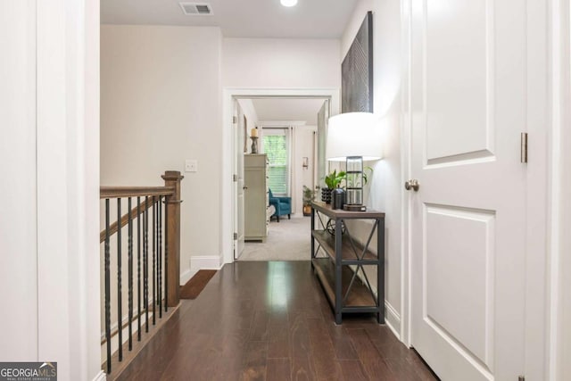 corridor with an upstairs landing, wood finished floors, baseboards, and recessed lighting