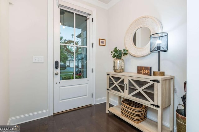 entryway with wood finished floors and baseboards