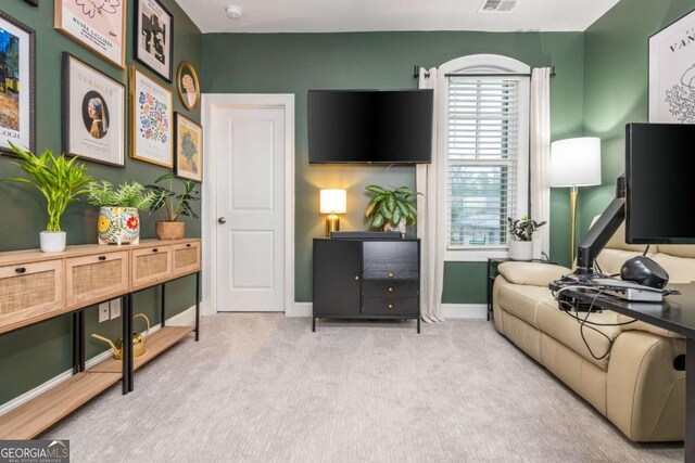living room featuring baseboards and carpet flooring