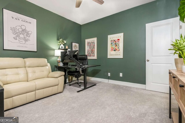 office featuring a ceiling fan, carpet flooring, and baseboards