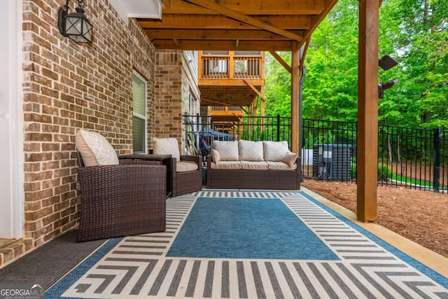 view of patio / terrace featuring an outdoor living space and fence