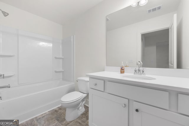 full bathroom featuring toilet, vanity, and  shower combination