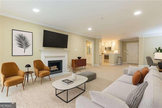 28106 Plantation Dr NE, Atlanta, GA 30324 - living area with baseboards, ornamental molding, recessed lighting, a fireplace with raised hearth, and light carpet