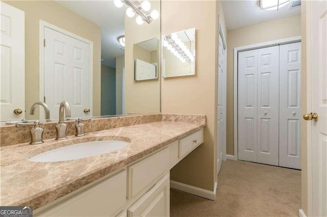 28106 Plantation Dr NE, Atlanta, GA 30324 - bathroom featuring vanity, baseboards, and a closet