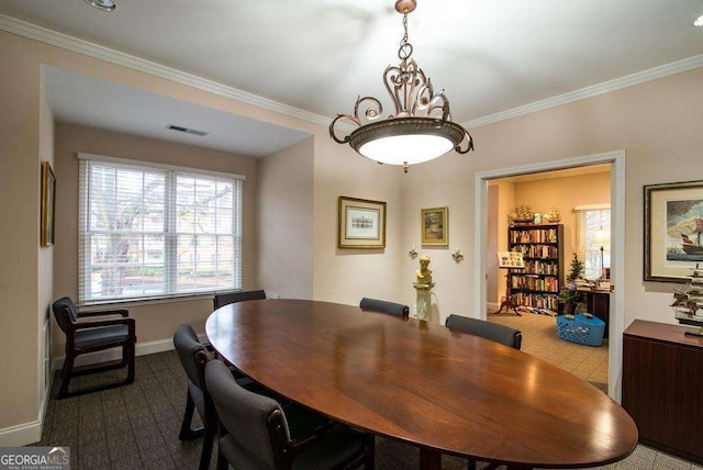 28106 Plantation Dr NE, Atlanta, GA 30324 - dining space with ornamental molding, baseboards, dark carpet, and a chandelier