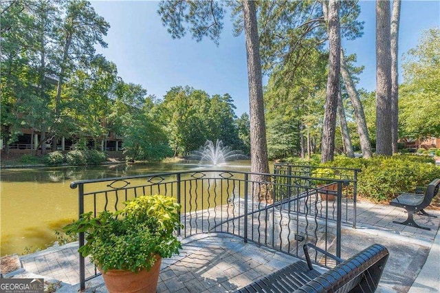 28106 Plantation Dr NE, Atlanta, GA 30324 - view of patio with a water view and view of wooded area