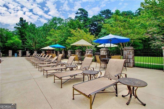 28106 Plantation Dr NE, Atlanta, GA 30324 - view of patio / terrace featuring fence and view of wooded area