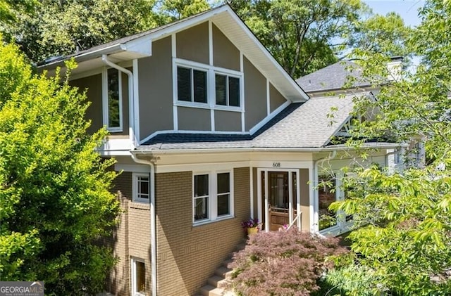 608 Sherwood Rd NE, Atlanta, GA 30324 - view of property exterior with brick siding and a shingled roof