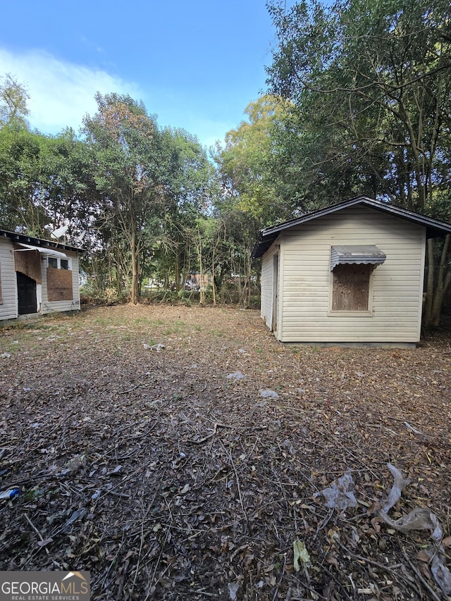 3846 Flamingo Dr, Macon, GA 31206 - view of yard with an outbuilding