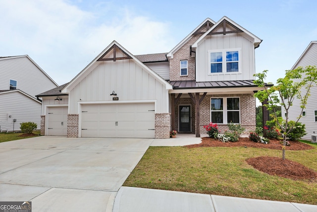 2436 Hidden Creek Rd, Kennesaw, GA 30152 - view of front of property featuring board and batten siding, brick siding, a garage, a front lawn, and concrete driveway