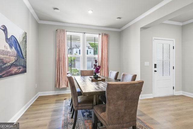 2436 Hidden Creek Rd, Kennesaw, GA 30152 - dining area with light wood-style flooring and ornamental molding