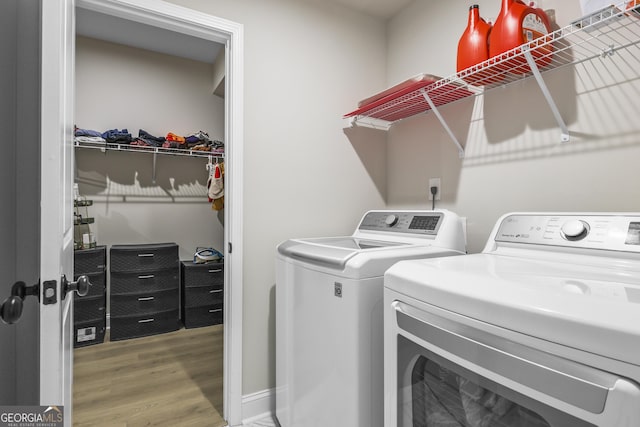 2436 Hidden Creek Rd, Kennesaw, GA 30152 - clothes washing area featuring separate washer and dryer and wood finished floors